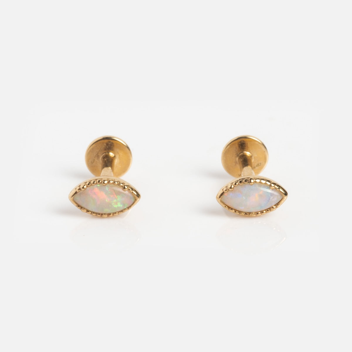 A pair of Solid Gold Opal Marquise Flat Back Studs featuring marquise-shaped opal gemstones in a sleek gold setting, displayed on a plain white background.