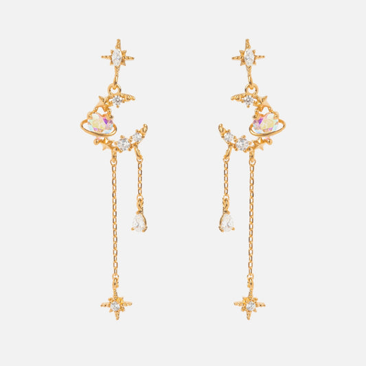 The Moonbeam Dangle Earrings Sample features star and planet designs with sparkling crystals, iridescent accents, CZ stones, sterling silver posts, two chains of different lengths, and delicate star-shaped details at the ends.