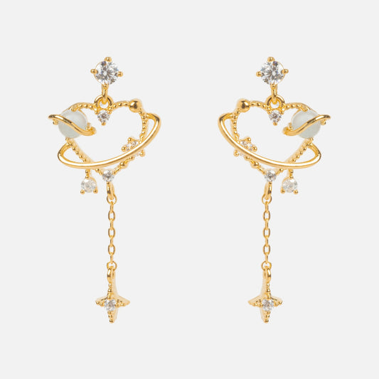 Dream Girl Dangle Hoops Sample: Heart-shaped gold earrings with orbit-like rings, sparkling CZ gems, and a dangling star charm. Set on 18k yellow gold plated sterling silver posts, shown against a plain white background.