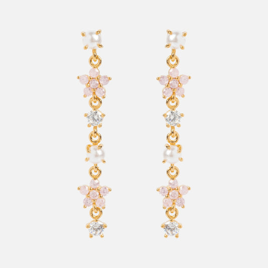 The Pearl Petals Dangle Earrings Sample showcases gold drop earrings with pink, white, and clear CZ stones in a floral pattern on sterling silver posts, set against a white background.