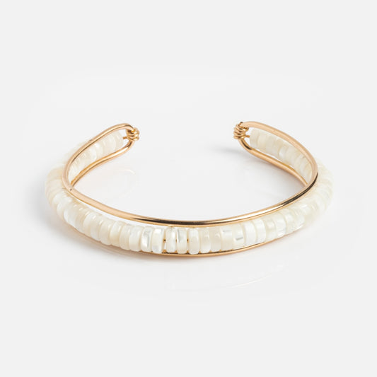 The Channel Cuff Sample is a gold-filled open cuff bracelet featuring a row of white round beads, handmade with care and photographed on a plain white background.