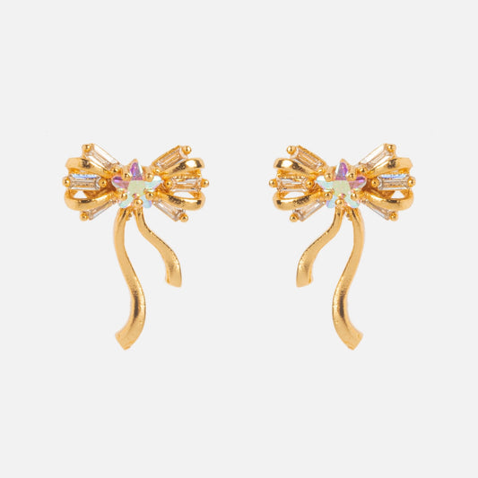 Coquette Bow Earrings Samples: Gold bow-shaped earrings with CZ gemstone accents, dangling ribbon-like tails, 18k gold-plated finish, and sterling silver posts. Displayed on a plain white background.