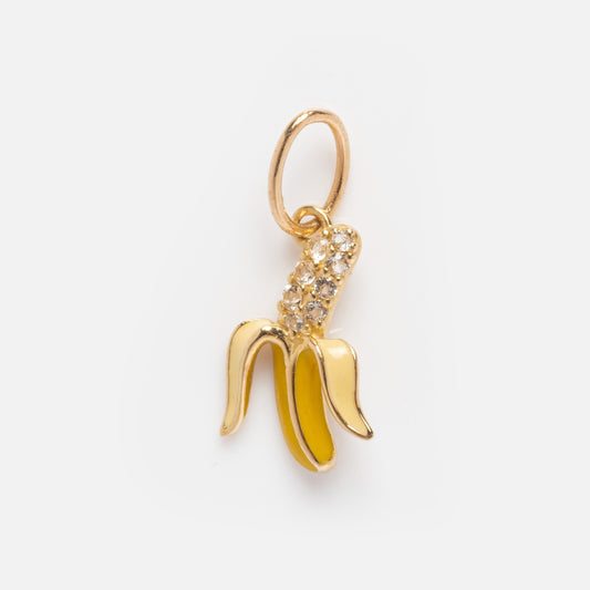 The Solid Gold Foodie Charm features a banana shape in 9k yellow gold with yellow enamel peel and sparkling rhinestones, attached to a small circular loop—ideal for adding playful fruit style to your necklace.