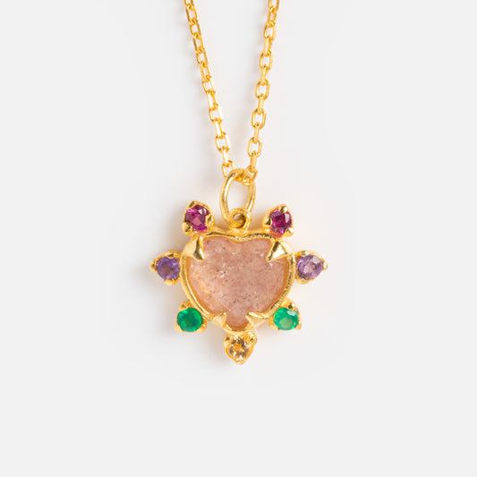 The Adore Necklace features a turtle-shaped pendant with a central strawberry quartz shell and colorful gemstone accents for the head, legs, and tail, all crafted in 18k gold vermeil on a delicate chain. Shown against a white background.