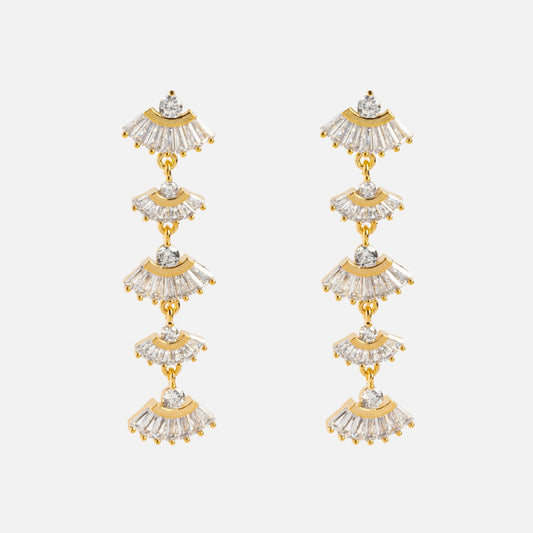 The Rene Drop Earrings feature yellow gold plating in an art deco style, with multiple fan-shaped segments embellished with cubic zirconia, arranged in a cascading, tiered design against a plain white background.