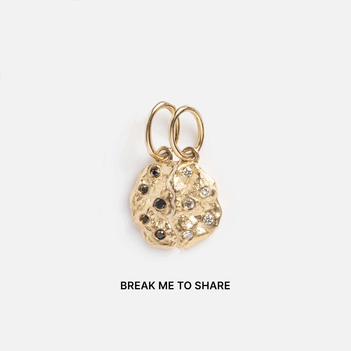 The Levain Bakery x Local Eclectic Solid Gold Share a Cookie Friendship Charm features two gem-studded cookie half charms above "BREAK ME TO SHARE," capturing playful friendship on a simple white background.
