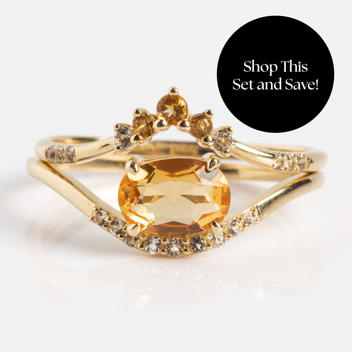 The Solid Gold 2025 November Capsule Citrine Ring Set with Free Gift features a central yellow gemstone and small clear stones, shown with a black circle that says, Shop This Set and Save!.
