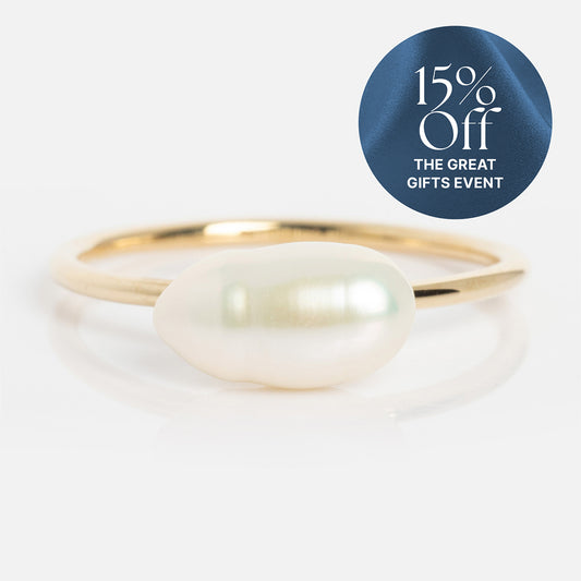 The Solid Gold Organic Pearl Solitaire Ring, featuring a single white baroque pearl, is shown on a white background. A blue circular label in the top right reads “15% Off THE GREAT GIFTS EVENT” in white text.