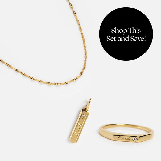 Shop the Tiny Fuck Gift Set: a 14k yellow gold plated chain necklace with a rectangular engraved pendant and matching “Tiny Fuck Ring.” Save when you shop this set!.