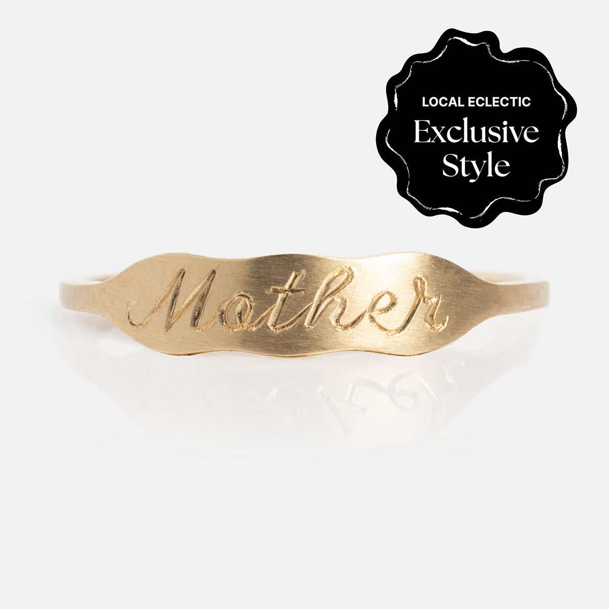 The 14k Ripples Customizable ID Band features a wavy gold design and can be engraved with "Mother" or your own text. This Local Eclectic exclusive ring is perfect for a unique, personal touch.