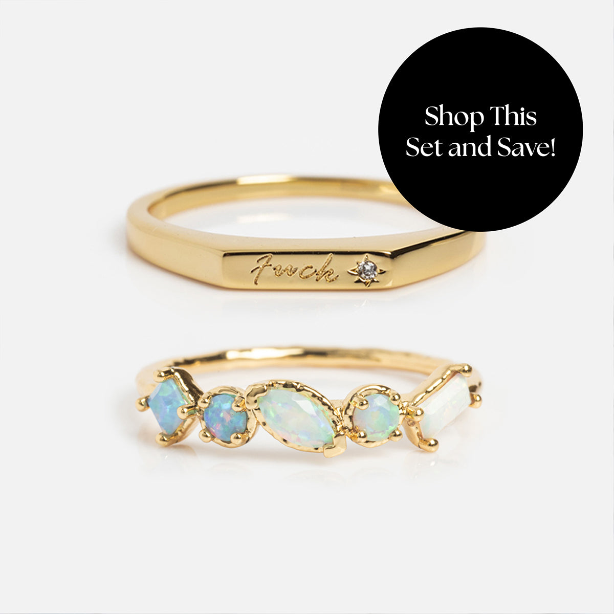 The Tiny Fuck Birthstone Stacking Ring Set includes a gold “Fuck” ring with a diamond and an ombre birthstone ring with five iridescent opals. Shop this personalized ring stack and save!.