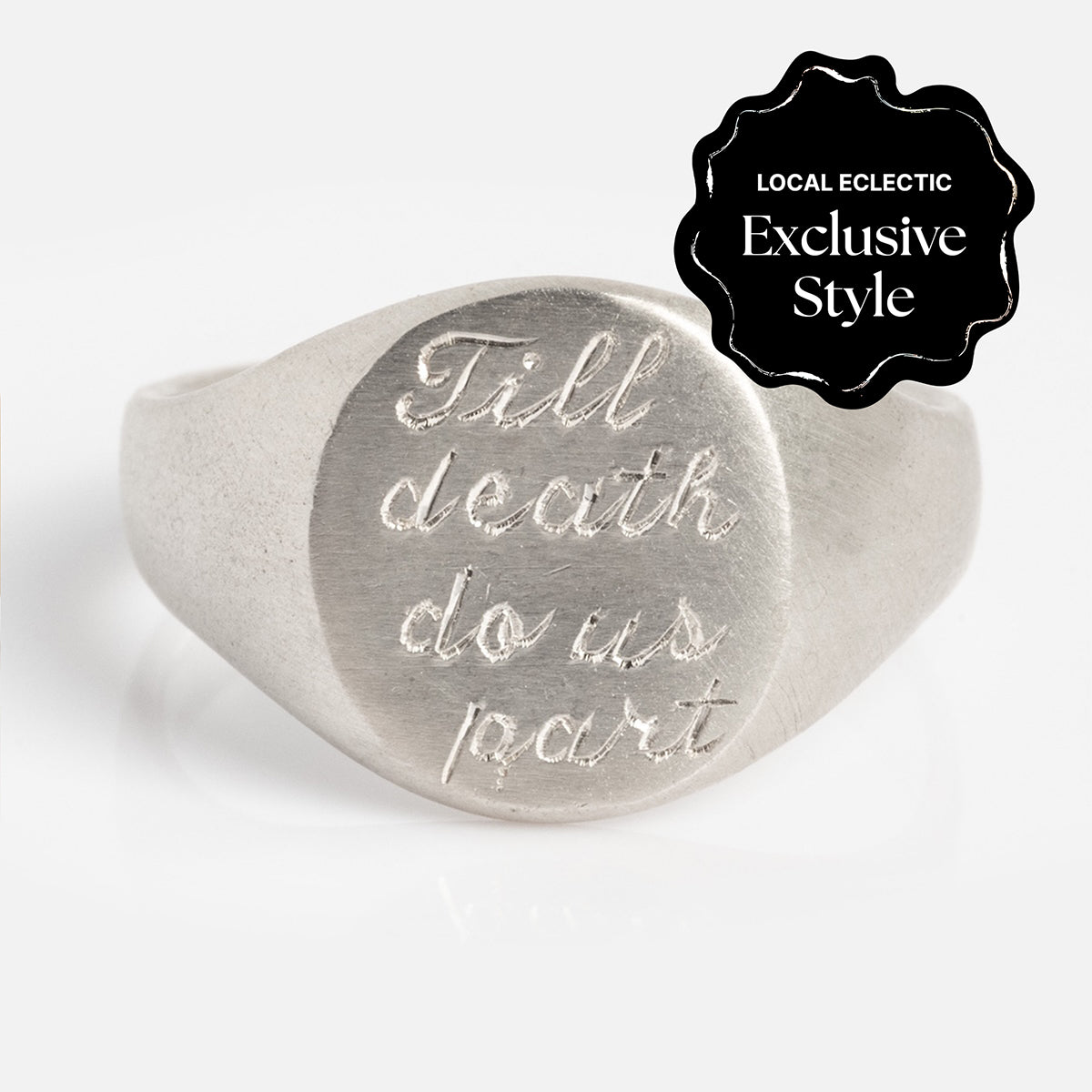 The Till Death Do Us Part Signet Ring is a silver ring engraved with “Till death do us part” on its face and features a black label reading Local Eclectic Exclusive Style.