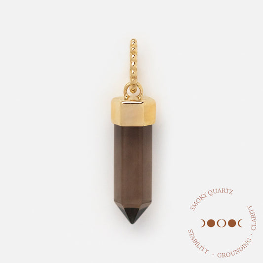 The Solid Gold Crystal Charm for Manifestation, featuring a gold-capped smoky quartz pendant, is shown on a white background. Text reads “Smoky Quartz: Stability, Grounding, Clarity” with crescent moon art—ideal for manifesting.
