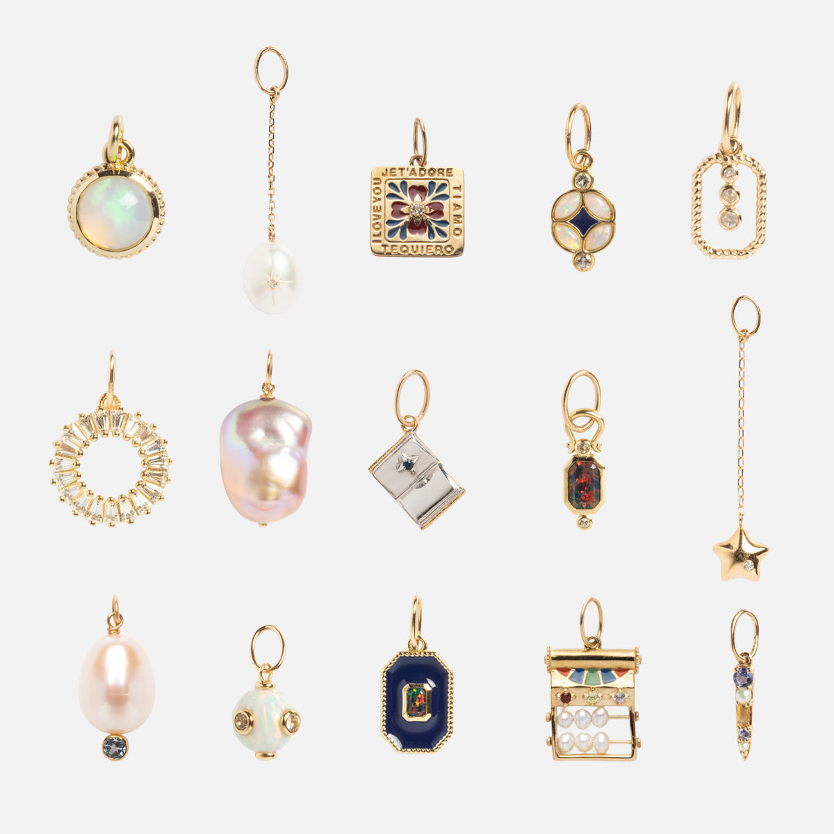 Discover 15 Solid Gold Statement Charm necklace pendants—featuring pearls, stars, squares, circles, and more—arranged in three rows on a white background for a unique and exclusive display.