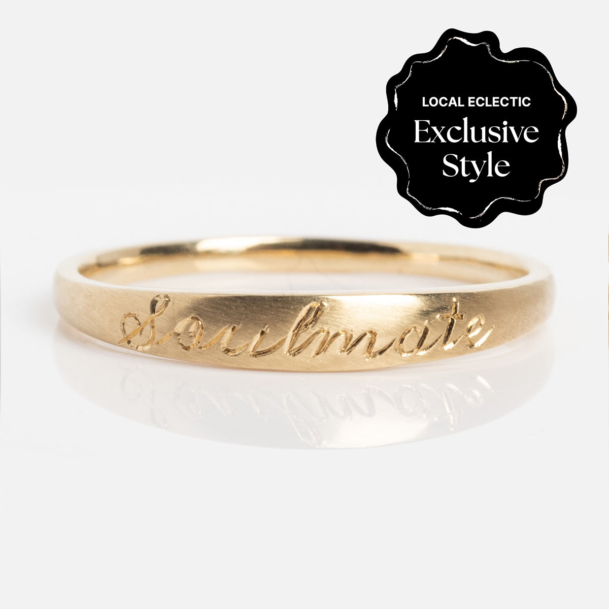 The Soulmate Band is a gold ring with a 1.4 mm band, engraved with "Soulmate" in cursive. A black badge at the top right says "Local Eclectic Exclusive Style" on a plain white background.