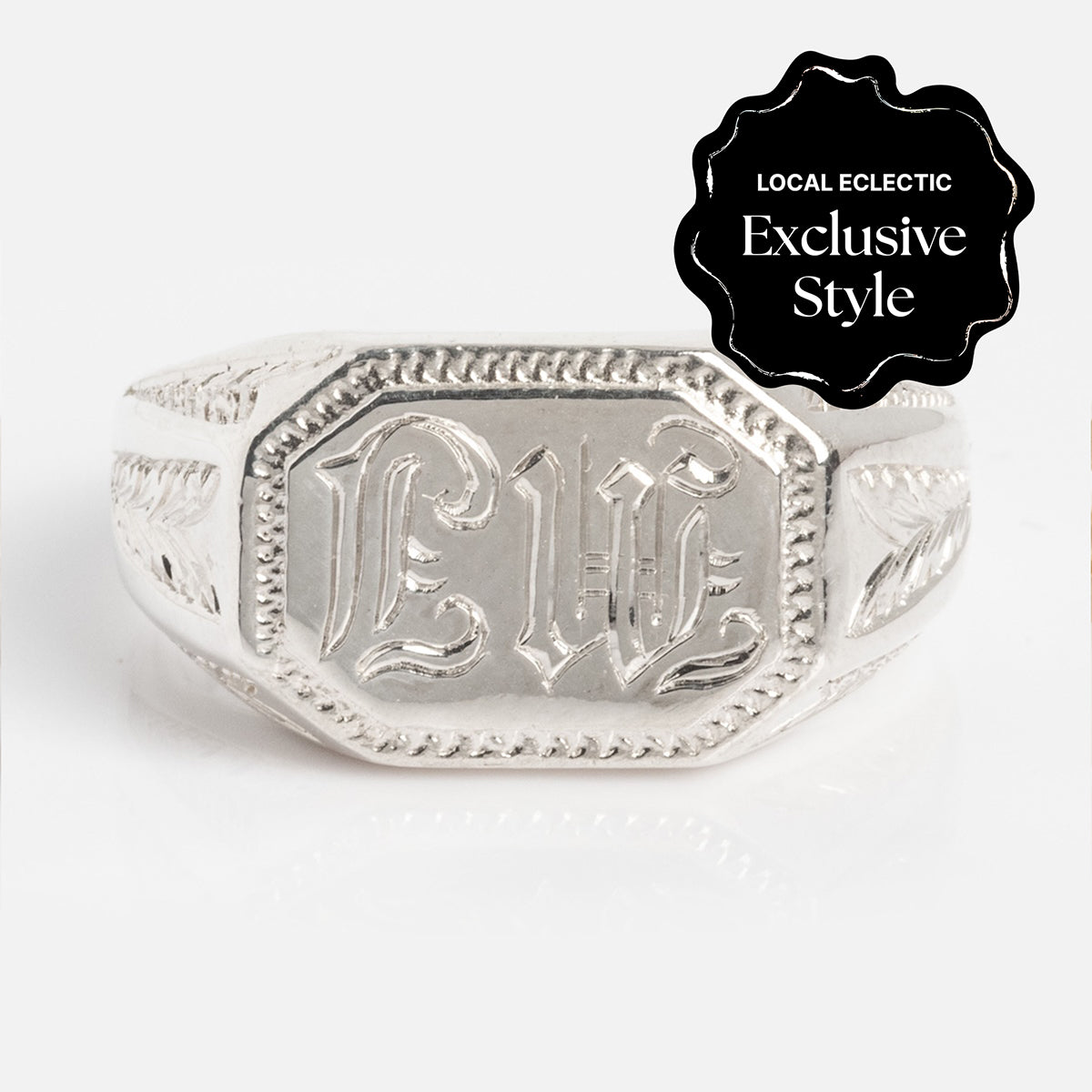 The Sovereign Signet Ring features ornate engravings and the letters LWE in an Old English font on the front, with a black badge reading LOCAL ECLECTIC Exclusive Style.