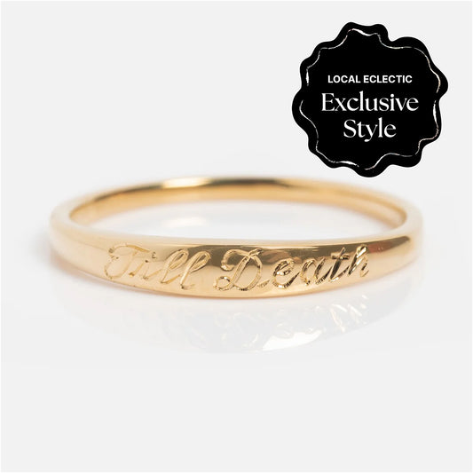 The 14k Till Death Layering Ring by Charlie and Marcelle features Till Death engraved on a slim gold band. This style is a Local Eclectic exclusive.