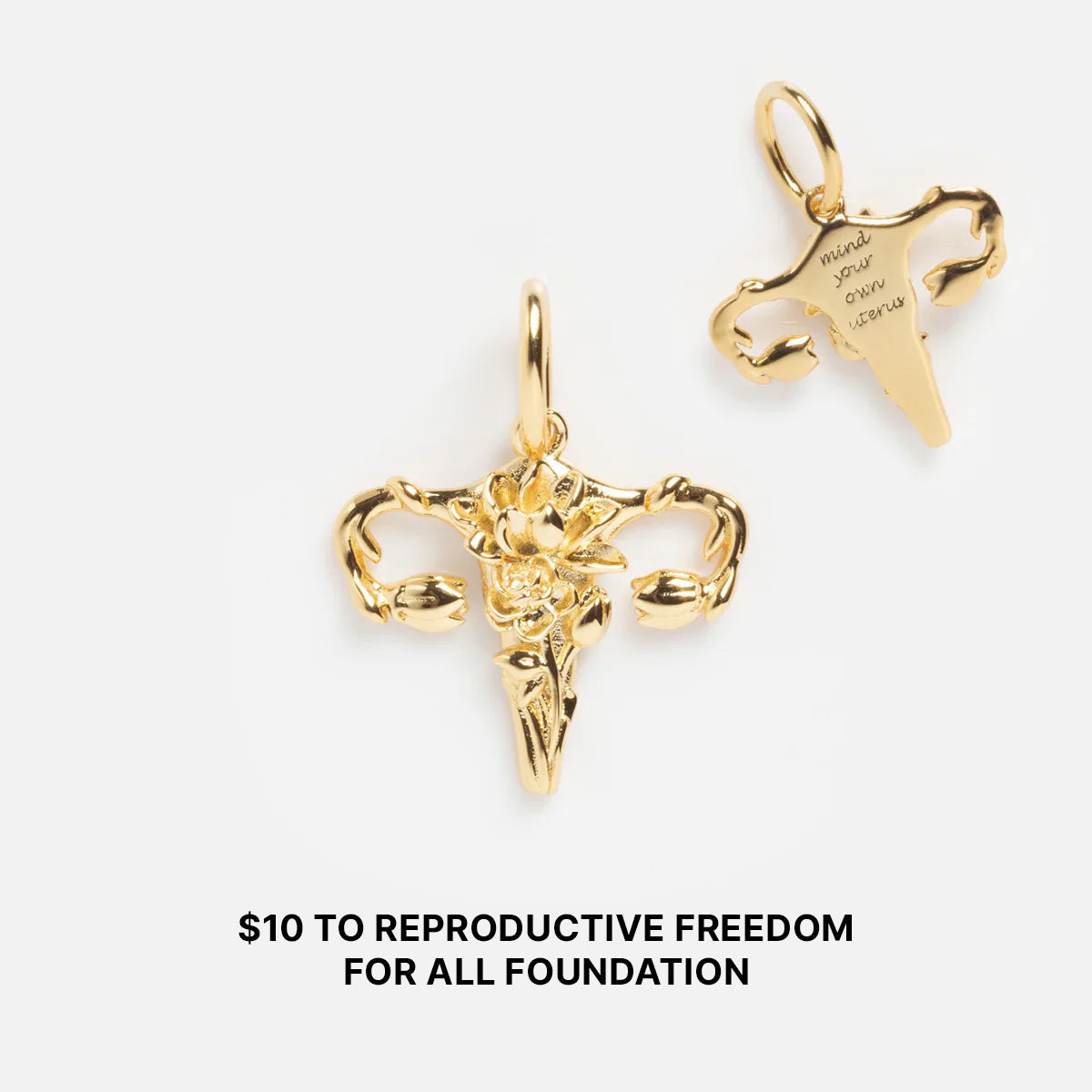 The Limited Edition Women's History Month Charms—two gold uterus-shaped pendants, one floral and one engraved with "mind your own uterus"—are displayed on a plain background. $10 to Reproductive Freedom for All Foundation.