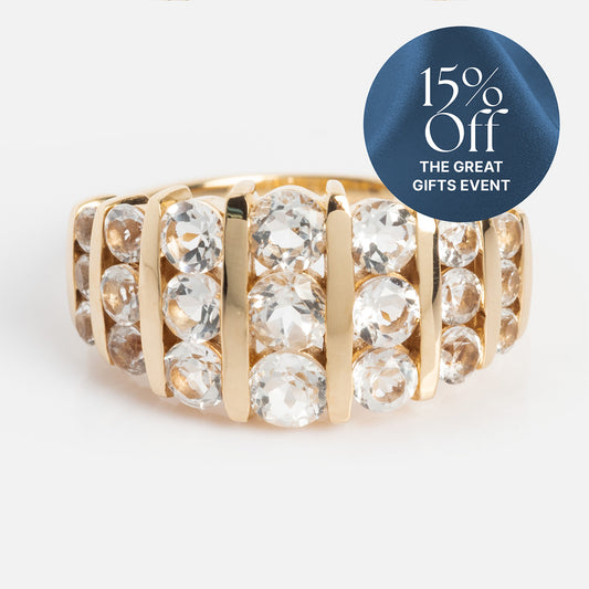 The 14k Regal White Topaz Statement Ring showcases multiple rows of large, round white topaz stones set in gold. A blue label in the top right corner says “15% Off THE GREAT GIFTS EVENT.”.