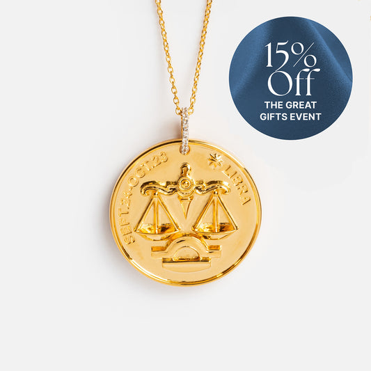 The Vintage Inspired Zodiac Coin Necklace features Libra's scales and engraved dates, with a diamond-studded bail. A circular blue label in the corner says “15% Off THE GREAT GIFTS EVENT”—the perfect personalized zodiac jewelry.