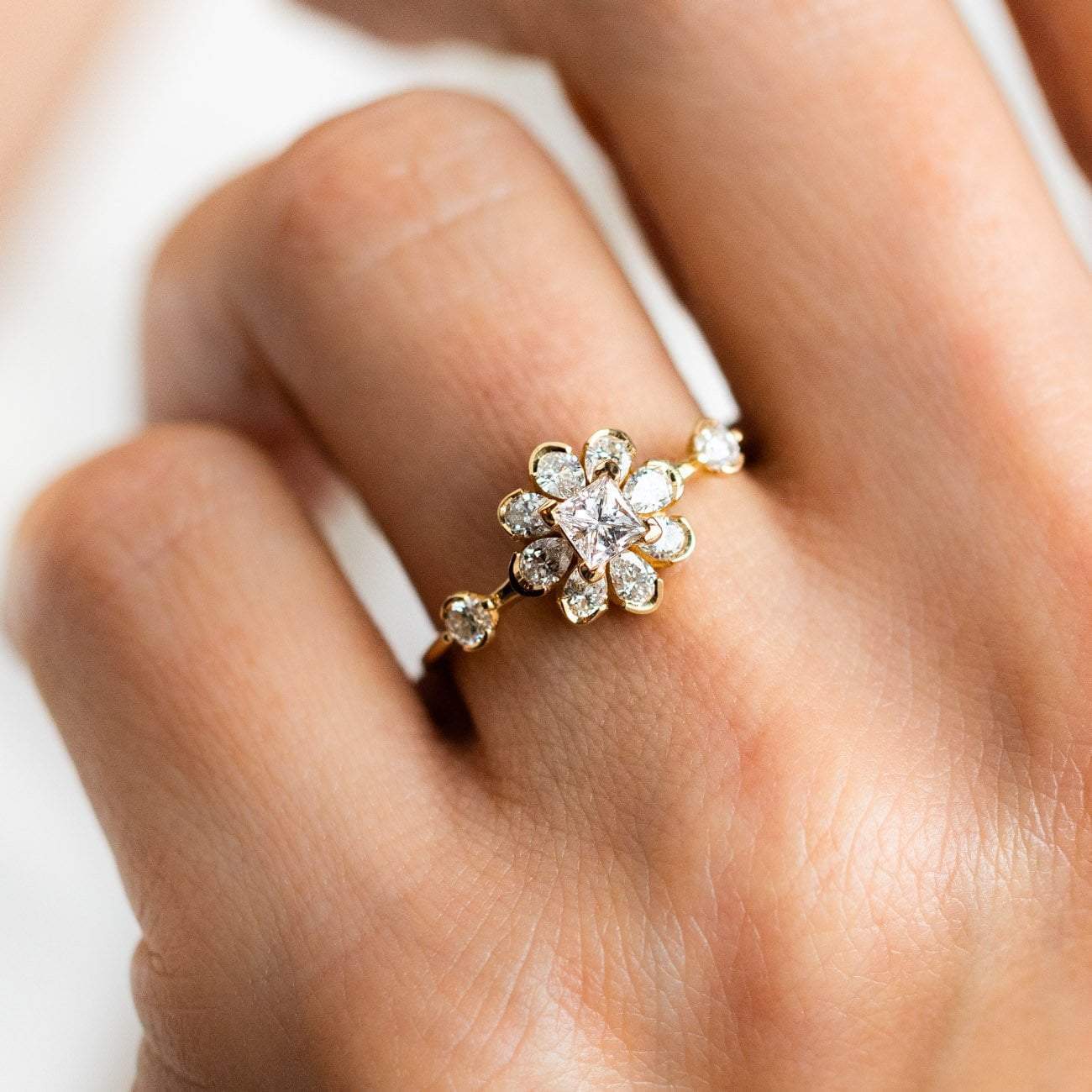 Local Eclectic Gold Diamond Flower Engagement Ring on Finger