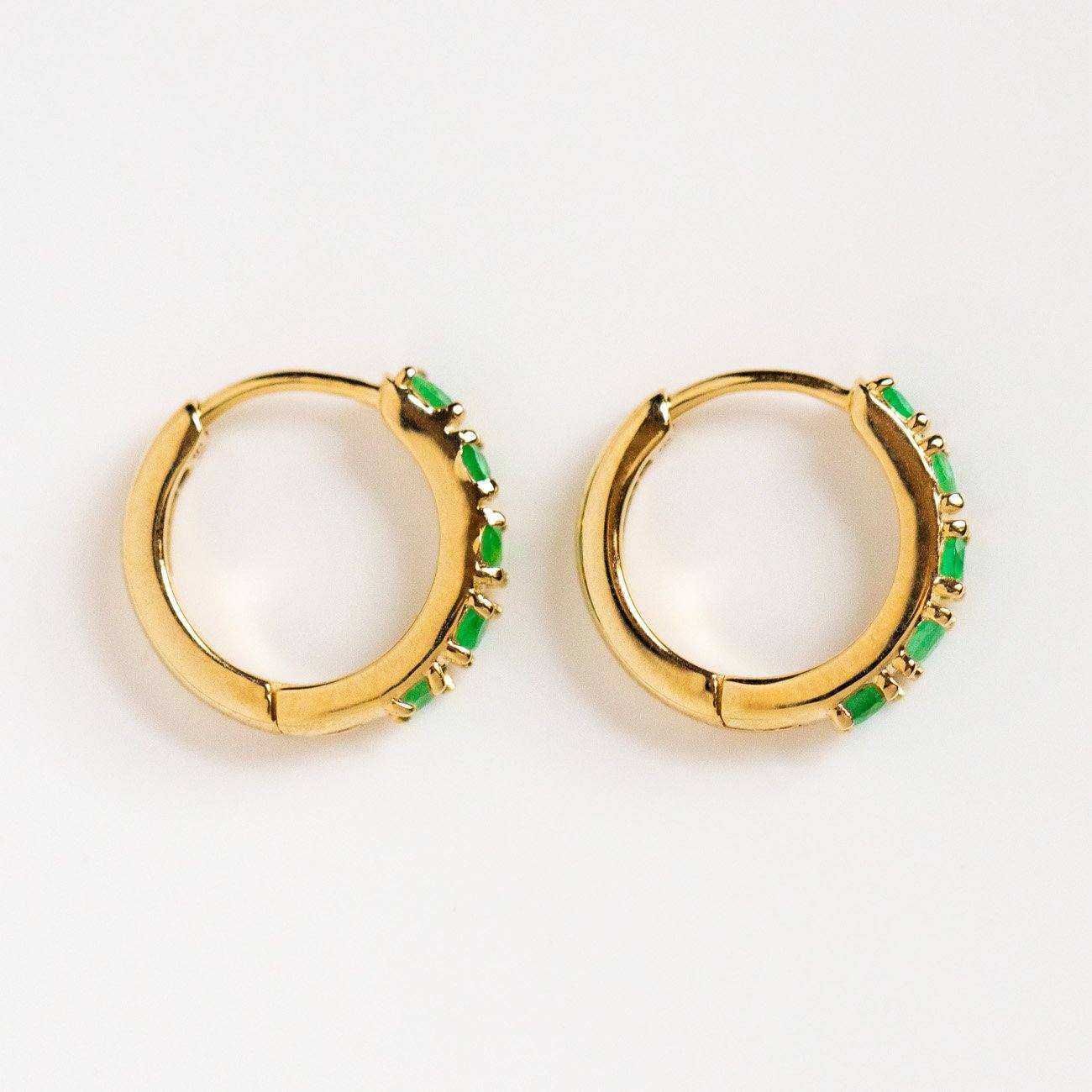 solid yellow gold emerald huggie hoops yellow gold modern jewelry