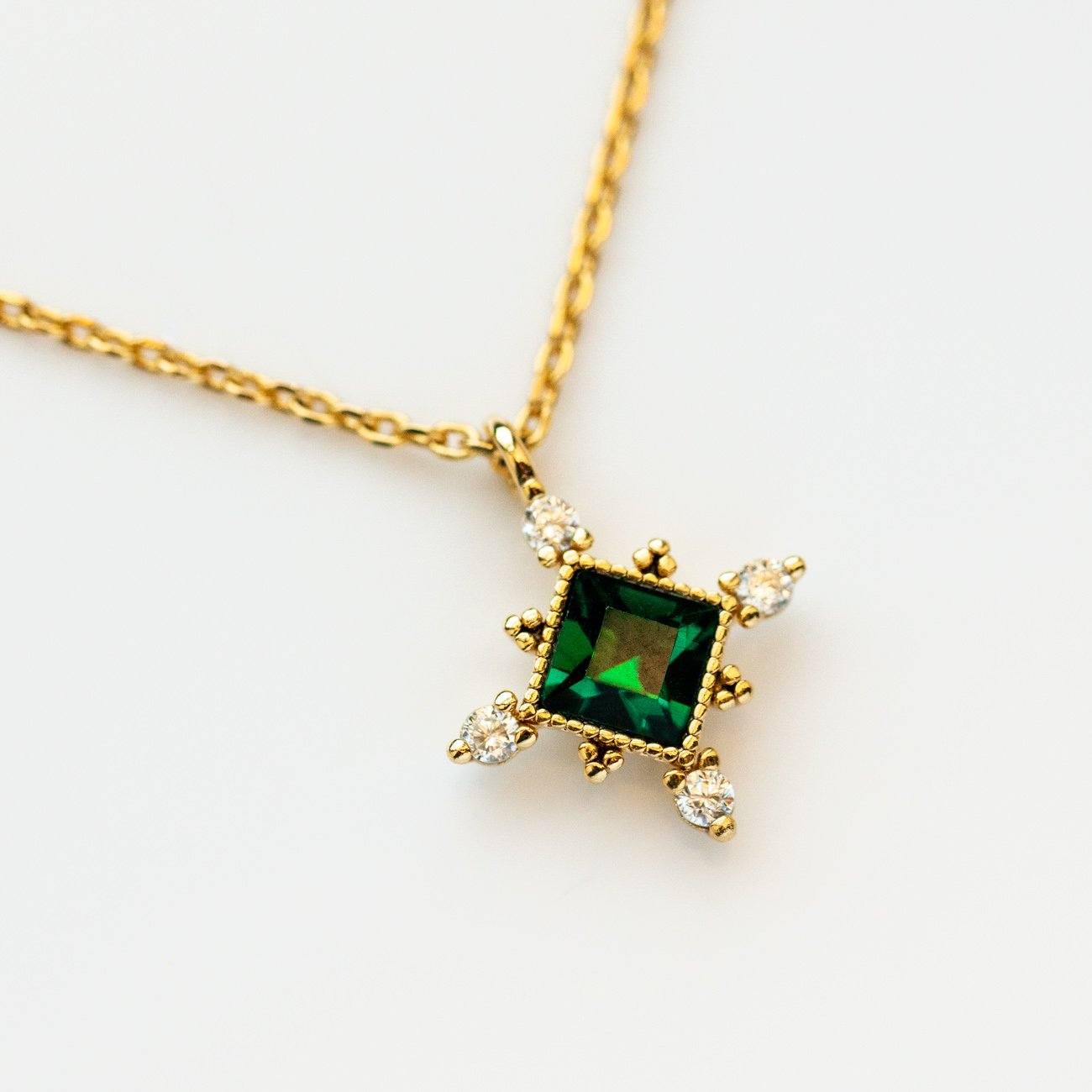 The Emerald Sierra Necklace from Lover's Tempo is vintage inspired and featured Emerald Swarovski crystal with a yellow gold chain.