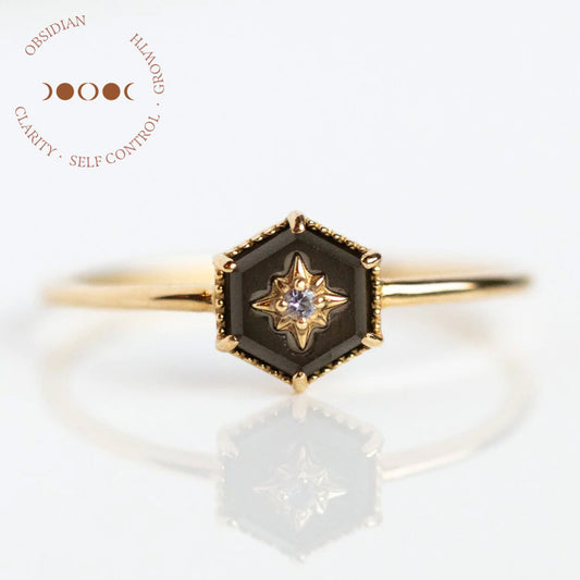 The Solid Gold Crystal Ring for Manifestation features a striking black obsidian stone set in 9k solid yellow gold, accented with a shimmering diamond. Available in sample size 7.