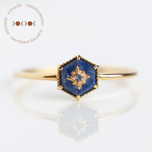 A Solid Gold Crystal Ring for Manifestation featuring sodalite, sample size 7, is displayed on a white background with circular descriptive text beside it.